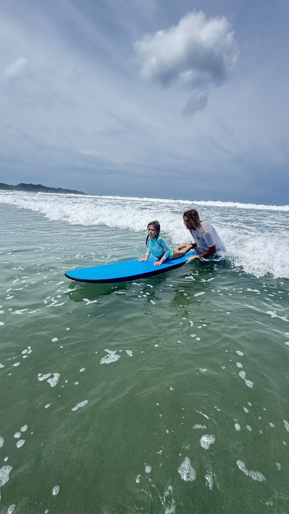 Paddling out together.